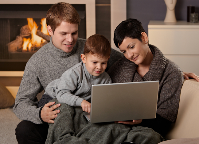 family looking at computer