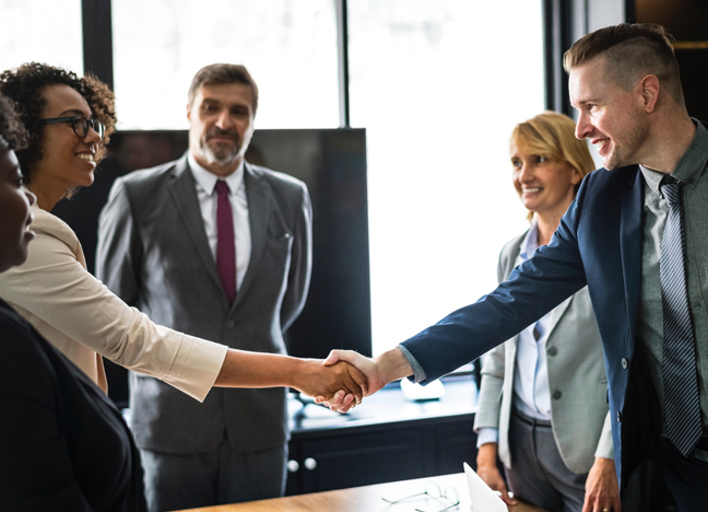 bankers shaking hands with new business clients